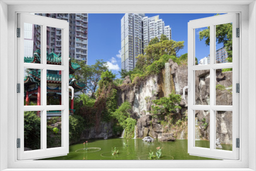 Fototapeta Naklejka Na Ścianę Okno 3D - View of pond and Hexagonal Pavilion at the Sik Sik Yuen Wong Tai Sin Temple in Hong Kong, China.
