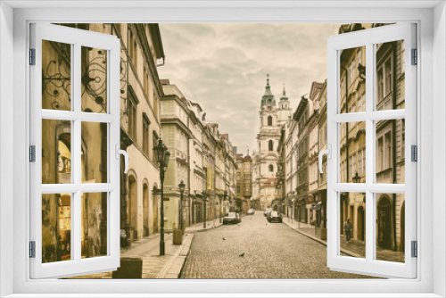 Fototapeta Naklejka Na Ścianę Okno 3D - View to the street in the old center of Prague - the capital and largest city of the Czech Republic - vintage sepia retro travel background