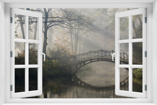 Fototapeta Naklejka Na Ścianę Okno 3D - Old bridge in misty autumn park