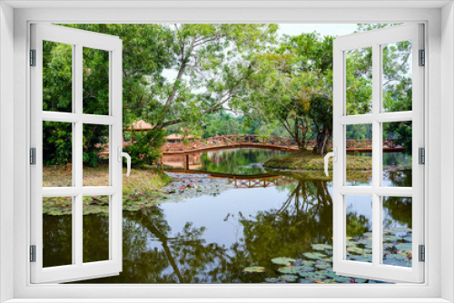 Fototapeta Naklejka Na Ścianę Okno 3D - Beautiful garden with bridge and reflection in the lake