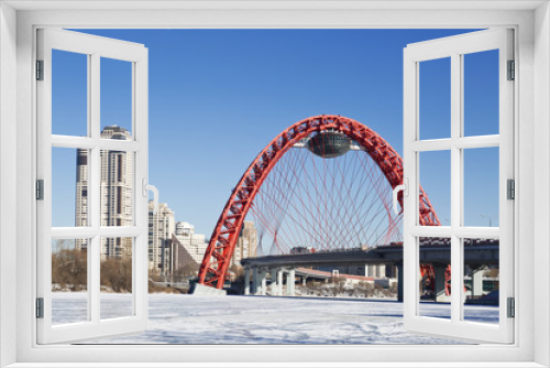 Fototapeta Naklejka Na Ścianę Okno 3D - Red bridge over the frozen Moskva river, Moscow, Russia