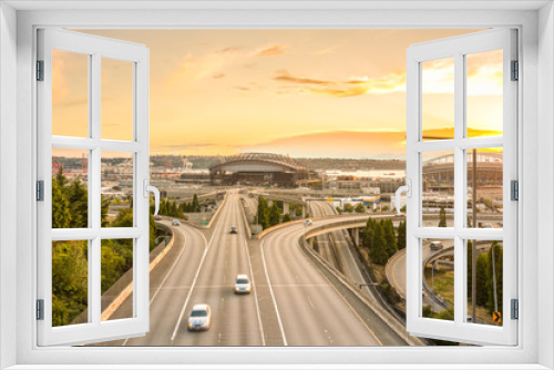 Fototapeta Naklejka Na Ścianę Okno 3D - scene of Seattle skylines and Interstate freeways in the sunset.