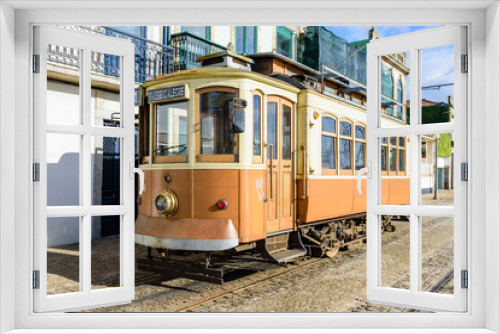 Fototapeta Naklejka Na Ścianę Okno 3D - Vintage old retro tram on the street of the town, Porto, Portugal.