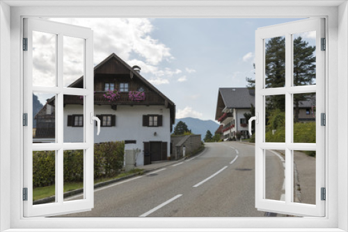 Fototapeta Naklejka Na Ścianę Okno 3D - Road through Alpine village in Austria