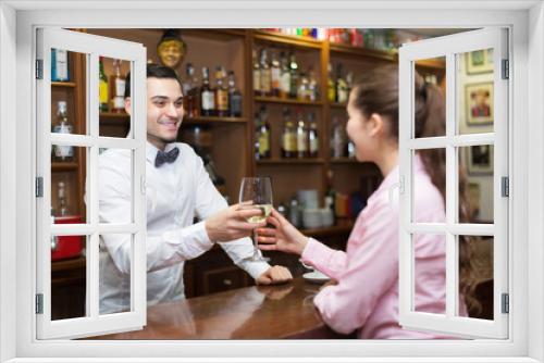 Female drinking wine at counter