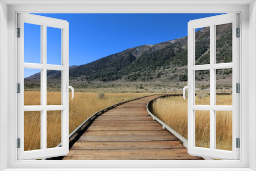 Fototapeta Naklejka Na Ścianę Okno 3D - Follow wooden boardwalk path through prairie - landscape photo 