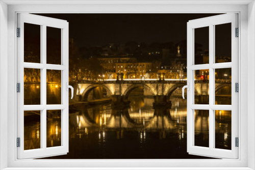 Ponte Sant Sisto reflected in the Tiber river, Saint Peter dome