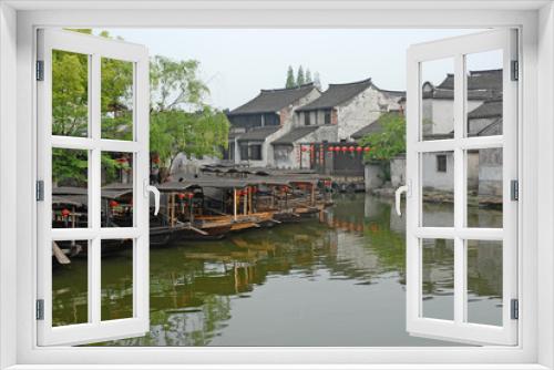 Fototapeta Naklejka Na Ścianę Okno 3D - Shanghai, boats and old houses  at the Xitang ancient town.