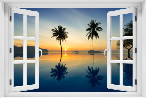 Fototapeta Naklejka Na Ścianę Okno 3D - Silhouette of coconut trees agains sunrise off of the sea