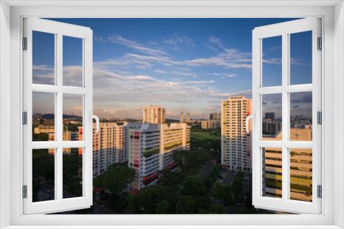 Fototapeta Naklejka Na Ścianę Okno 3D - Sunset over residential apartments - Singapore