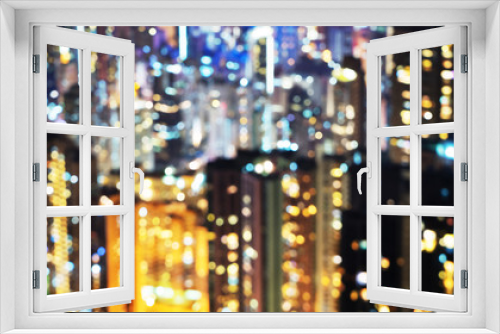 Fototapeta Naklejka Na Ścianę Okno 3D - blurred lights in windows of skycrapers, Hong Kong