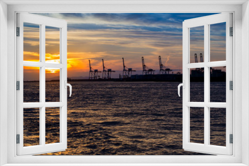 Fototapeta Naklejka Na Ścianę Okno 3D - Industrial port, nice Sunset sky with silhouette industrial port, Osaka, Japan