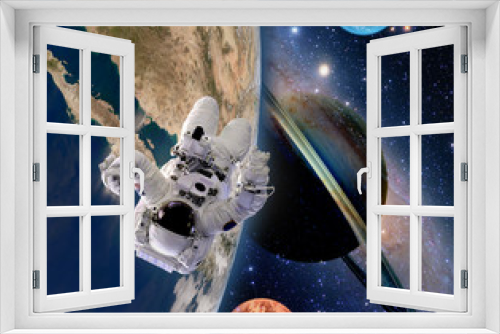 Fototapeta Naklejka Na Ścianę Okno 3D - Astronaut spaceman moon saturn planet spacewalk earth outer space walk galaxy. Elements of this image furnished by NASA.