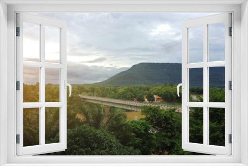 Fototapeta Naklejka Na Ścianę Okno 3D - Sunrise on forest mountain and Bridge over the river