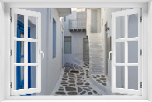 Fototapeta Naklejka Na Ścianę Okno 3D - Traditional architecture in the town of Mykonos and characteristic narrow streets for pedestrians.