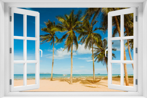 Fototapeta Naklejka Na Ścianę Okno 3D - Coconut trees on blue-sky background at the beach
