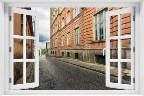 Fototapeta Naklejka Na Ścianę Okno 3D - Wide view on street of old european city