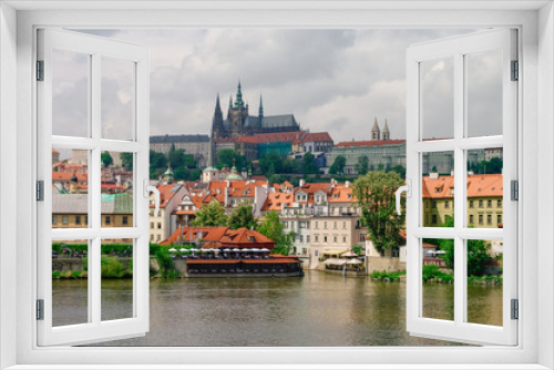 View of colorful old town, Prague castle and St. Vitus Cathedral with river Vltava, Czech Republic