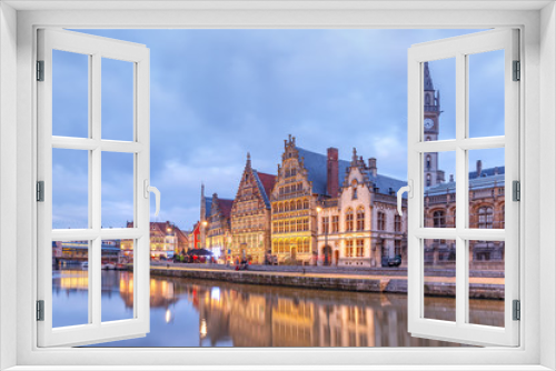 Picturesque medieval buildings on the quay Graslei and Leie river at Ghent town in the evening, Belgium