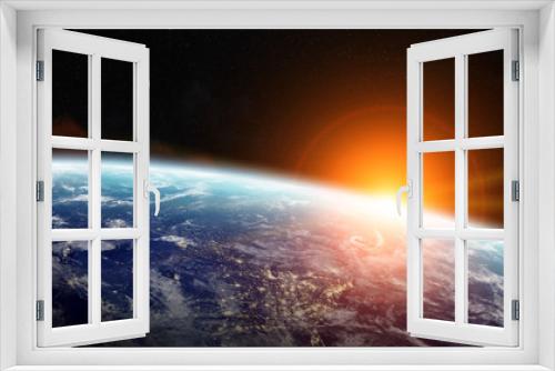 Fototapeta Naklejka Na Ścianę Okno 3D - Sunrise over planet Earth in space