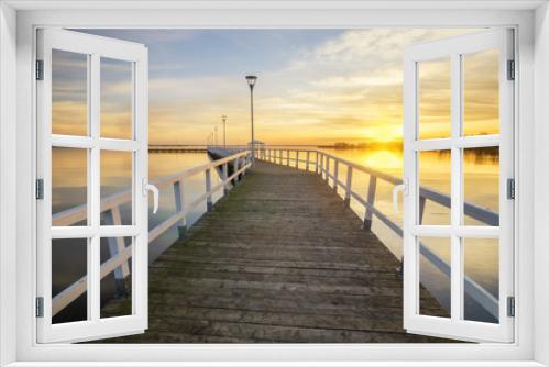 Fototapeta Naklejka Na Ścianę Okno 3D - wooden, white pier on the bay at sunset