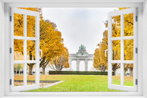 Fototapeta Naklejka Na Ścianę Okno 3D - Fall trees in Parc du Cinquantenaire or Jubelpark is public park in Brussels, Belgium. The Triumphal Arch  seen in background.  Panoramic montage from 3 HDR images