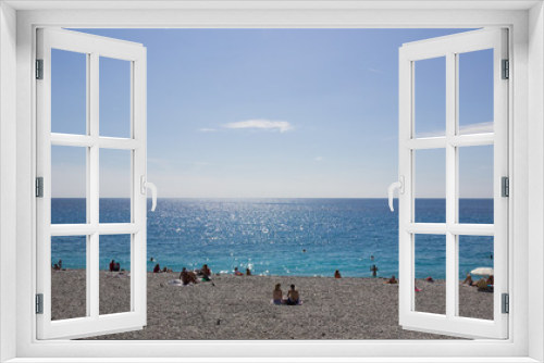 Fototapeta Naklejka Na Ścianę Okno 3D - People sunbathing on the Cote d'Azur in Nice, France 