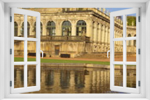 Zwinger palace in Dresden with reflection in pond