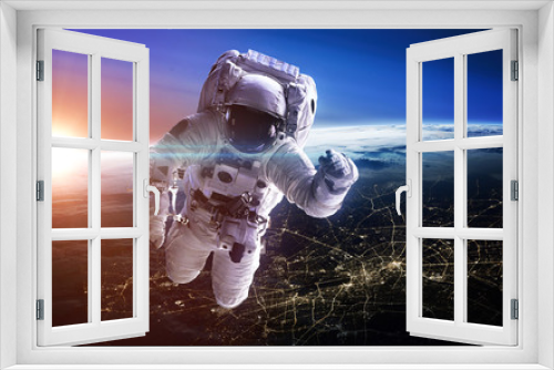 Fototapeta Naklejka Na Ścianę Okno 3D - Astronaut in outer space. Spacewalk. Elements of this image furnished by NASA