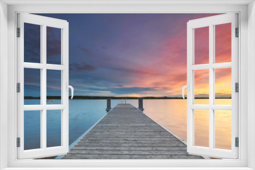 Fototapeta Naklejka Na Ścianę Okno 3D - pastellfarbener Sonnenuntergang am Meer mit Holzsteg