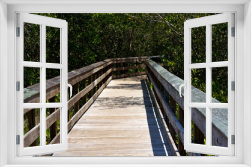 Fototapeta Naklejka Na Ścianę Okno 3D - Railed wooden boardwalk in florida