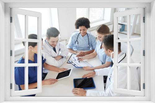 group of happy doctors meeting at hospital office