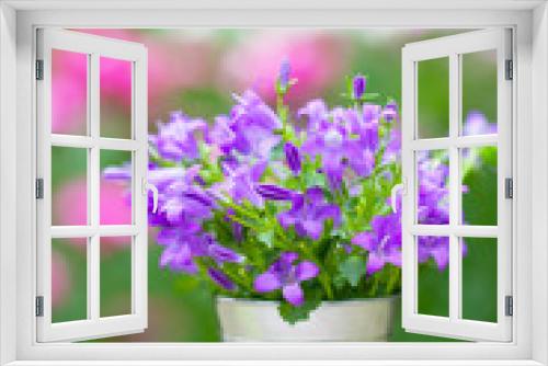 Fototapeta Naklejka Na Ścianę Okno 3D - Bouquet of purple flowers in small bucket - vertical