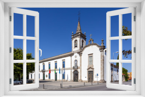 Fototapeta Naklejka Na Ścianę Okno 3D - Lapa Chapel - a Sacred Art Museum (right), and the Lusiada University branch (left) in Vila Nova de Famalicao, Portugal.