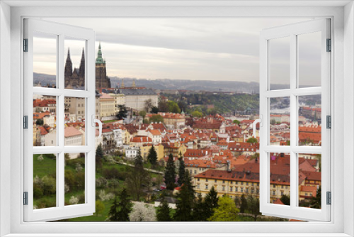 Fototapeta Naklejka Na Ścianę Okno 3D - View on the spring Prague City with gothic Castle, green Nature and flowering Trees, Czech Republic