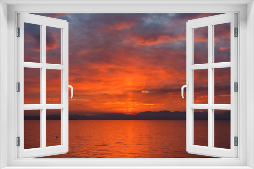 Fototapeta Naklejka Na Ścianę Okno 3D - Sunset over the Garda lake
