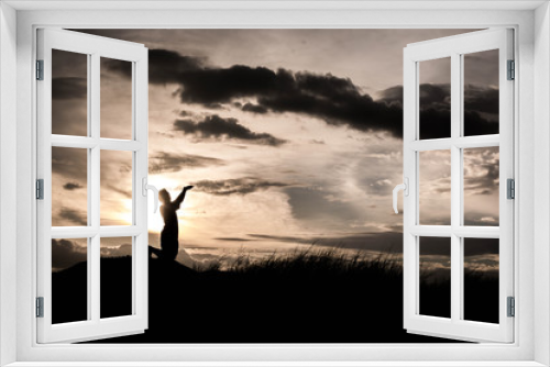 Fototapeta Naklejka Na Ścianę Okno 3D - boy praying at sunset time, sihouette concept