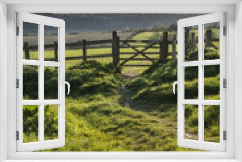Fototapeta Naklejka Na Ścianę Okno 3D - Beautiful English countryside landscape over fields at sunset