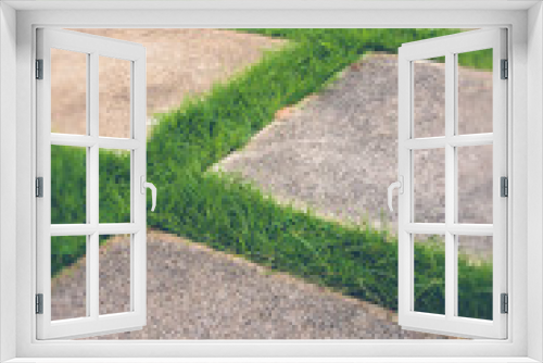 Fototapeta Naklejka Na Ścianę Okno 3D - Beautiful grass tiles walk way in the garden (filter effect used