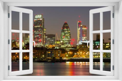 Fototapeta Naklejka Na Ścianę Okno 3D - Cityscape of London with reflection in Thames river at night, UK