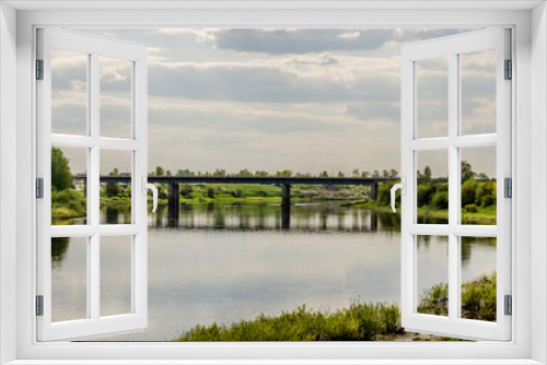 Fototapeta Naklejka Na Ścianę Okno 3D - View above big beautiful river with blue sky and green grass in Belarus, Polotsk.