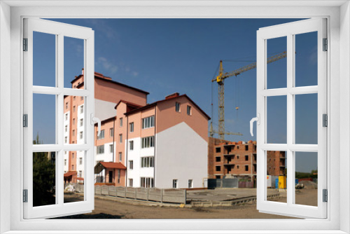 Fototapeta Naklejka Na Ścianę Okno 3D - The process of construction of multi-apartment building
