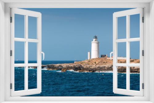 Fototapeta Naklejka Na Ścianę Okno 3D - Sunny view of lighthouse of Tarifa port, Andalusia provice, Spain.