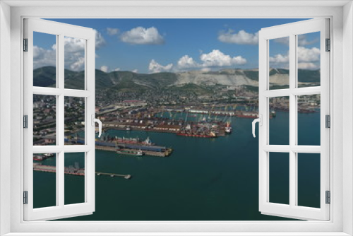 Fototapeta Naklejka Na Ścianę Okno 3D - Industrial seaport, top view. Port cranes and cargo ships and barges.