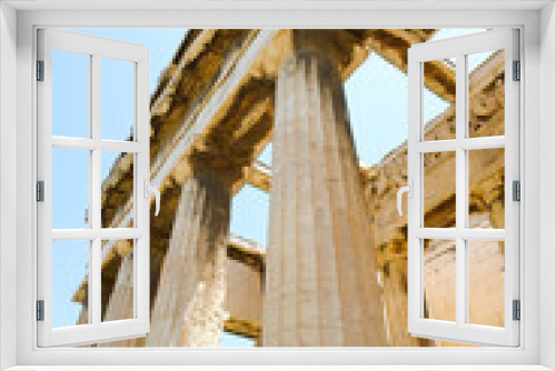 Fototapeta Naklejka Na Ścianę Okno 3D - Looking up view of famous Greek temple pillars against clear blue sky in Greece