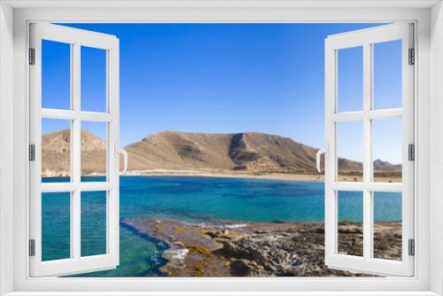 Fototapeta Naklejka Na Ścianę Okno 3D - Beautiful view on bright blue bay against of mountain, in Playazo de Rodalquilar, Cabo de Gata, Nijar, Spain