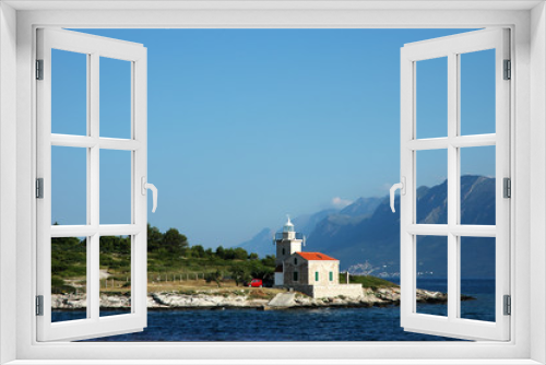 Fototapeta Naklejka Na Ścianę Okno 3D - Seascape and lighthouse on the coast near Hvar island, Croatia