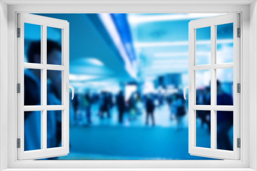 Blurred image of people with blue color filler