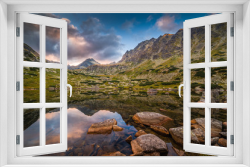 Fototapeta Naklejka Na Ścianę Okno 3D - Mountain Lake Above Skok Waterfall with Rocks in Foreground and Strbsky Peak in Background at Sunset. Mlynicka Valley, High Tatra, Slovakia.