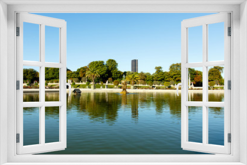 Fototapeta Naklejka Na Ścianę Okno 3D - Wide angle view of pond in Luxembourg Gardens, Paris, France, with the Montparnesse Tower in the background. Horizontal with copy space for text